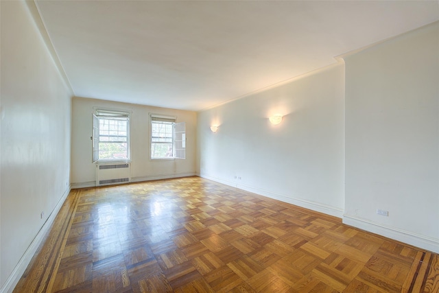 117-01 Park Ln S Unit C5D, Kew Gardens, NY 11415 - spare room featuring radiator heating unit and baseboards