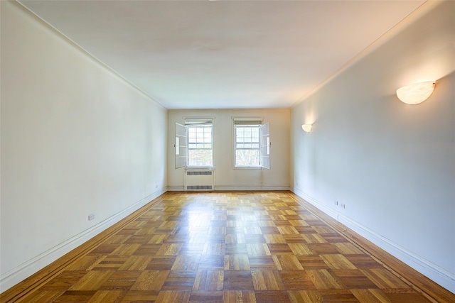 117-01 Park Ln S Unit C5D, Kew Gardens, NY 11415 - spare room featuring radiator heating unit and baseboards