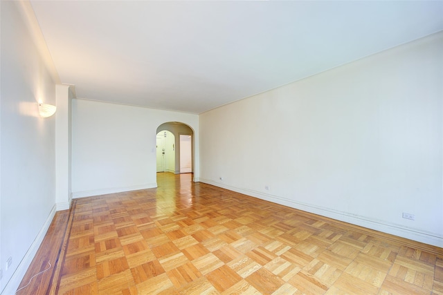 117-01 Park Ln S Unit C5D, Kew Gardens, NY 11415 - unfurnished room featuring arched walkways and baseboards