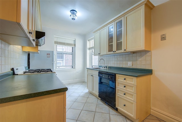 117-01 Park Ln S Unit C5D, Kew Gardens, NY 11415 - kitchen featuring dishwasher, dark countertops, light tile patterned flooring, and tasteful backsplash