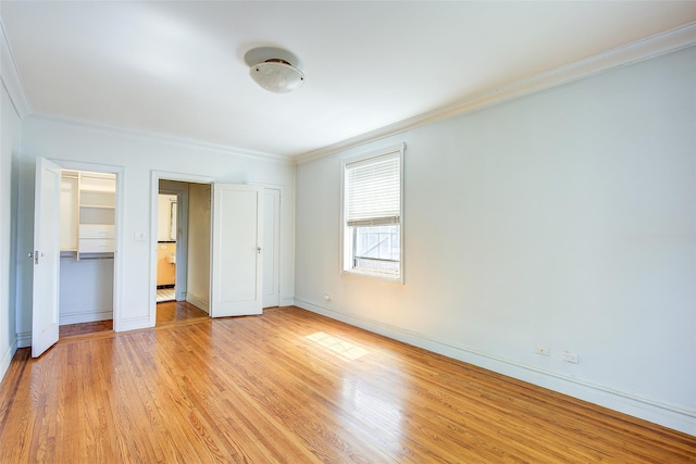 117-01 Park Ln S Unit C5D, Kew Gardens, NY 11415 - unfurnished bedroom with crown molding and light wood-style floors