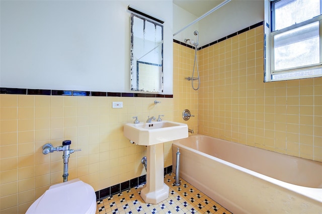 117-01 Park Ln S Unit C5D, Kew Gardens, NY 11415 - full bathroom featuring tile walls, washtub / shower combination, and tile patterned flooring