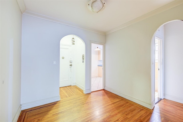 117-01 Park Ln S Unit C5D, Kew Gardens, NY 11415 - empty room with arched walkways, light wood-type flooring, and ornamental molding