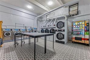 46-01 39th Ave Unit 106, Woodside, NY 11104 - rec room featuring stacked washer / drying machine and separate washer and dryer