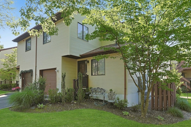 2 Dylan Ct, Nanuet, NY 10954 - view of front facade with a garage and a front lawn
