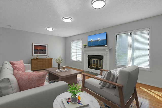 2 Dylan Ct, Nanuet, NY 10954 - living room with a premium fireplace, wood finished floors, and a textured ceiling