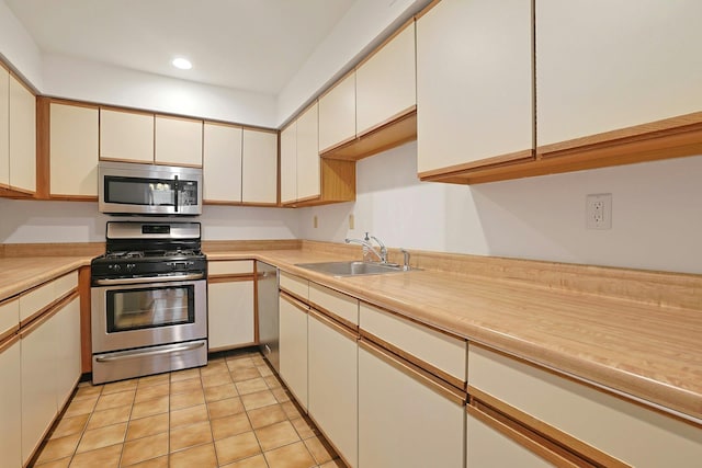 2 Dylan Ct, Nanuet, NY 10954 - kitchen with appliances with stainless steel finishes, light countertops, recessed lighting, and light tile patterned floors