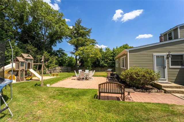 110 Roxbury Dr, Commack, NY 11725 - view of yard featuring a trampoline, a patio, and a playground