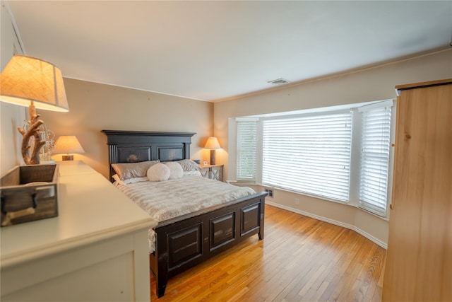 110 Roxbury Dr, Commack, NY 11725 - bedroom featuring light wood-type flooring and multiple windows