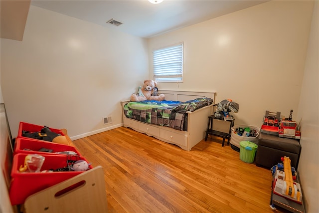 110 Roxbury Dr, Commack, NY 11725 - bedroom featuring wood finished floors and baseboards