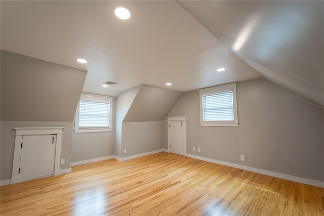 110 Roxbury Dr, Commack, NY 11725 - bonus room with wood finished floors, healthy amount of natural light, vaulted ceiling, and recessed lighting