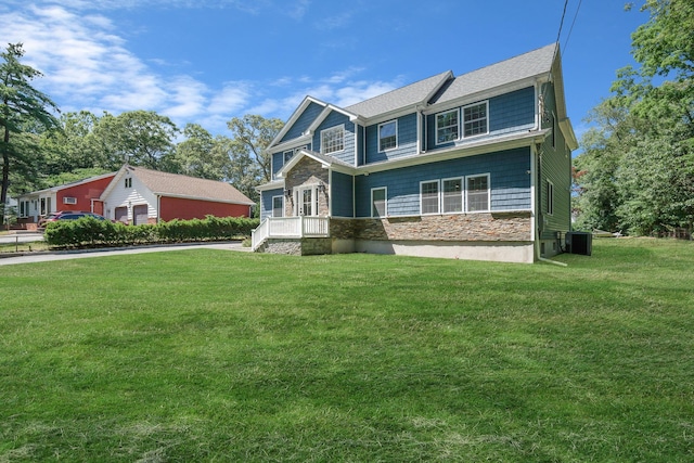 206 Brooksite Dr, Smithtown, NY 11787 - view of front facade featuring stone siding and a front yard
