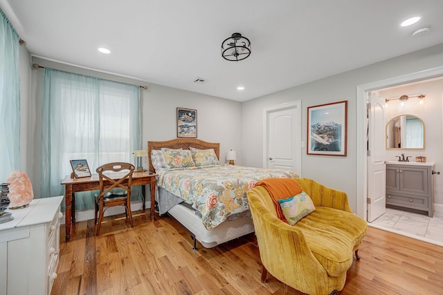206 Brooksite Dr, Smithtown, NY 11787 - bedroom with light wood-type flooring, ensuite bath, and recessed lighting