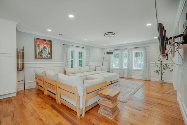 206 Brooksite Dr, Smithtown, NY 11787 - bedroom with ornamental molding, recessed lighting, a decorative wall, light wood-style flooring, and a wainscoted wall