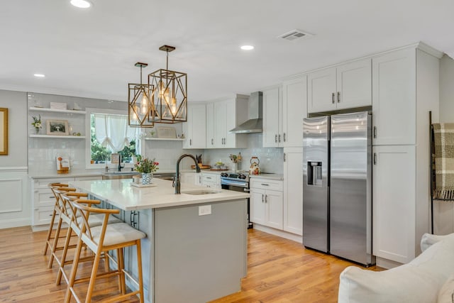 206 Brooksite Dr, Smithtown, NY 11787 - kitchen with stainless steel appliances, wall chimney range hood, decorative backsplash, light countertops, and recessed lighting