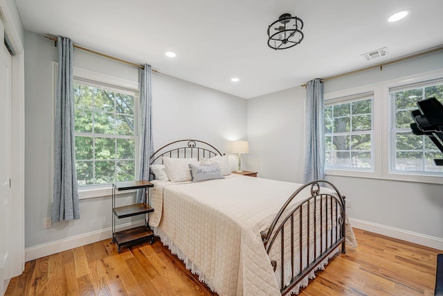 206 Brooksite Dr, Smithtown, NY 11787 - bedroom featuring light wood-type flooring and recessed lighting