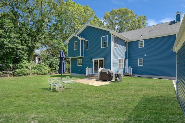 206 Brooksite Dr, Smithtown, NY 11787 - back of house featuring a lawn, a chimney, and a deck