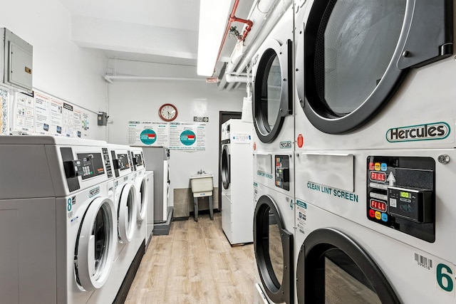 4265 Webster Ave Unit 6A, Bronx, NY 10470 - community laundry with stacked washing machine and dryer, washer and clothes dryer, and light wood finished floors