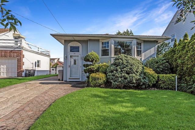 46 Pine St, Oceanside, NY 11572 - view of front of house with a front yard