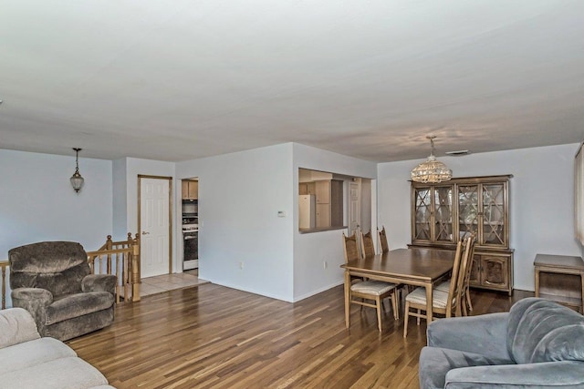 46 Pine St, Oceanside, NY 11572 - living area featuring a chandelier and wood finished floors