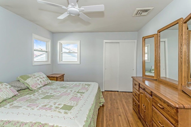46 Pine St, Oceanside, NY 11572 - bedroom with light wood finished floors, a ceiling fan, and a closet