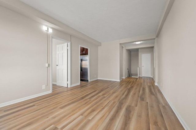 99-72 66th Rd Unit 9B, Rego Park, NY 11374 - unfurnished room with light wood finished floors and baseboards