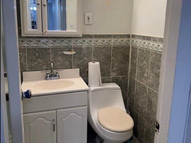 3410 De Reimer Ave Unit 2B, Bronx, NY 10475 - bathroom with tile walls and vanity