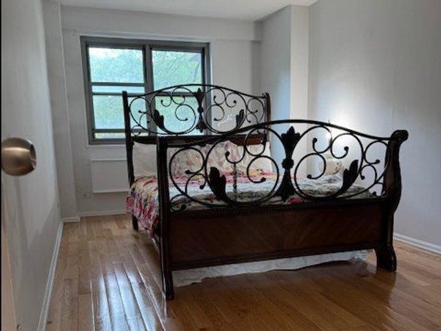 3410 De Reimer Ave Unit 2B, Bronx, NY 10475 - bedroom featuring wood-type flooring and baseboards