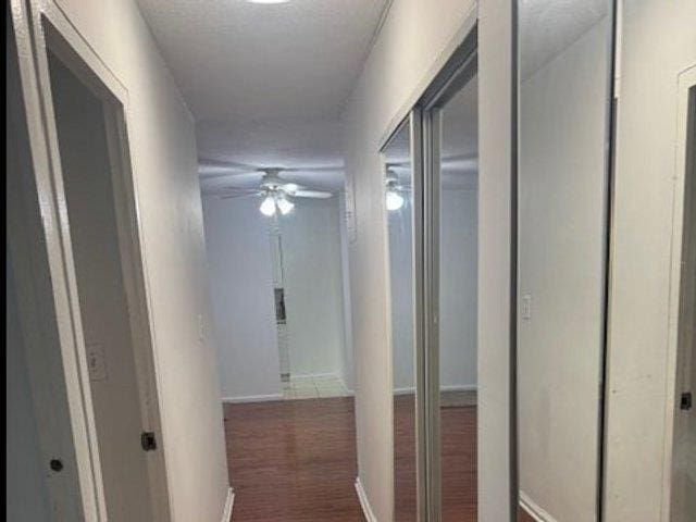 3410 De Reimer Ave Unit 2B, Bronx, NY 10475 - corridor featuring baseboards and wood finished floors