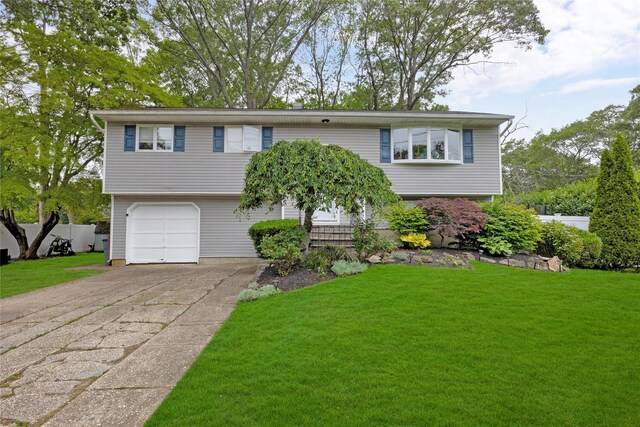 26 Shenandoah Blvd, Port Jefferson Station, NY 11776 - split foyer home with concrete driveway and an attached garage