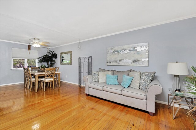 26 Shenandoah Blvd, Port Jefferson Station, NY 11776 - living area with wood-type flooring, a ceiling fan, and ornamental molding