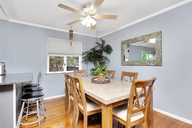 26 Shenandoah Blvd, Port Jefferson Station, NY 11776 - dining space with hardwood / wood-style flooring, a ceiling fan, plenty of natural light, and ornamental molding