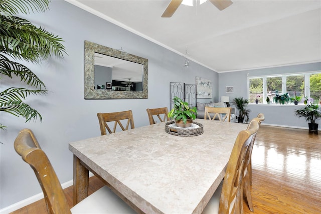 26 Shenandoah Blvd, Port Jefferson Station, NY 11776 - dining room with ornamental molding, wood finished floors, a ceiling fan, and lofted ceiling