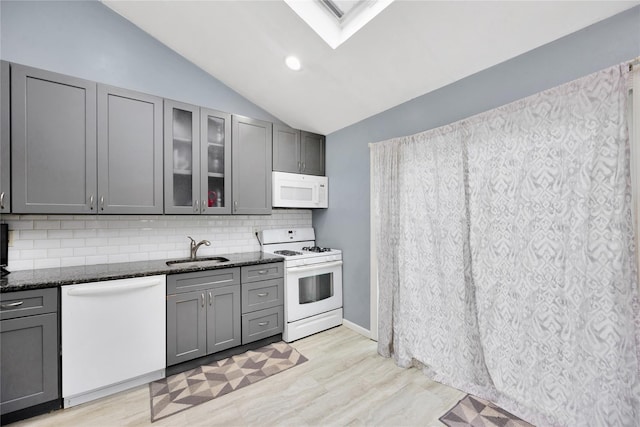 26 Shenandoah Blvd, Port Jefferson Station, NY 11776 - kitchen with white appliances, gray cabinets, a skylight, dark stone countertops, and lofted ceiling