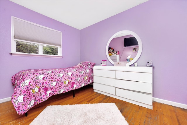 26 Shenandoah Blvd, Port Jefferson Station, NY 11776 - bedroom featuring baseboards and wood finished floors
