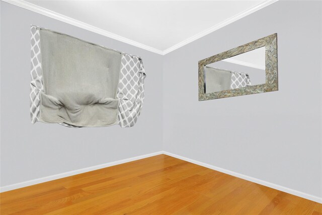 26 Shenandoah Blvd, Port Jefferson Station, NY 11776 - empty room featuring ornamental molding and wood finished floors