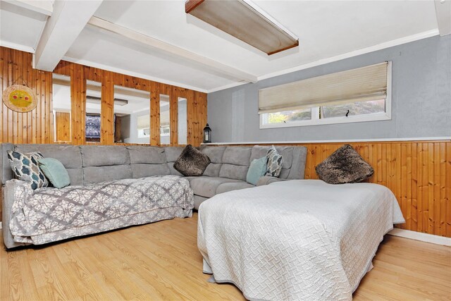 26 Shenandoah Blvd, Port Jefferson Station, NY 11776 - bedroom featuring wood walls, beam ceiling, light wood-style flooring, and ornamental molding
