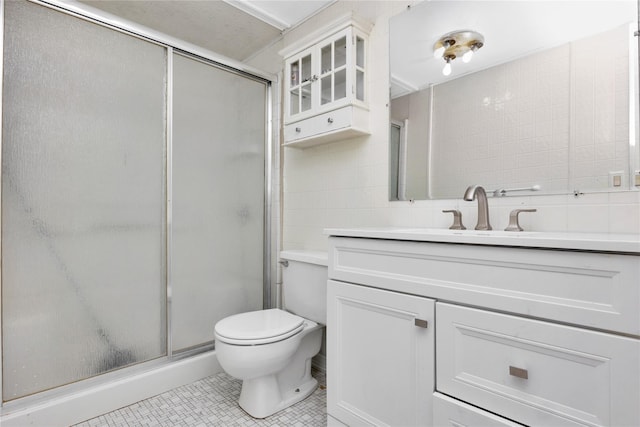 26 Shenandoah Blvd, Port Jefferson Station, NY 11776 - full bathroom featuring vanity, a shower stall, tile patterned flooring, and tile walls