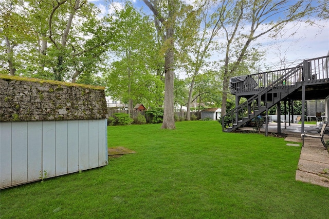 26 Shenandoah Blvd, Port Jefferson Station, NY 11776 - view of grassy yard featuring stairs, a shed, and a deck