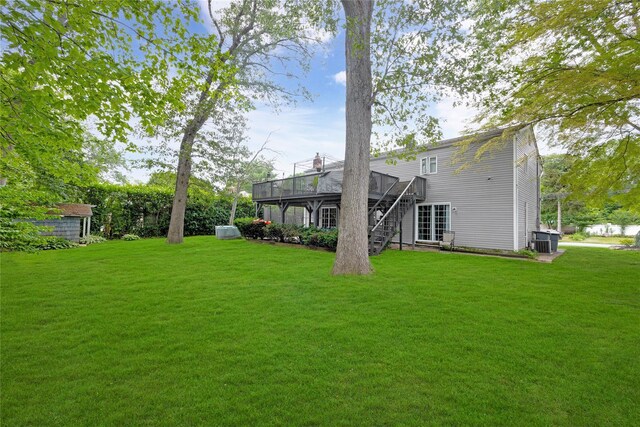 26 Shenandoah Blvd, Port Jefferson Station, NY 11776 - view of green lawn with a wooden deck and stairway