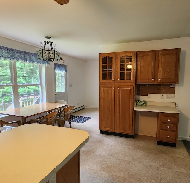 7219 State Rte 42, Grahamsville, NY 12740 - kitchen with baseboard heating, brown cabinets, and light countertops