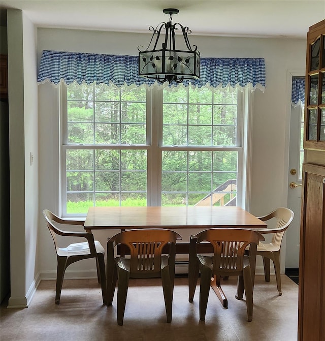 7219 State Rte 42, Grahamsville, NY 12740 - dining space with a chandelier and plenty of natural light
