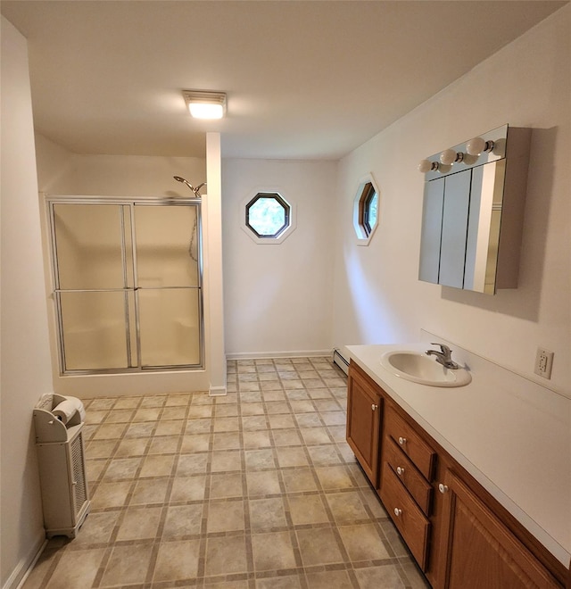 7219 State Rte 42, Grahamsville, NY 12740 - bathroom featuring vanity, a shower stall, and a baseboard heating unit