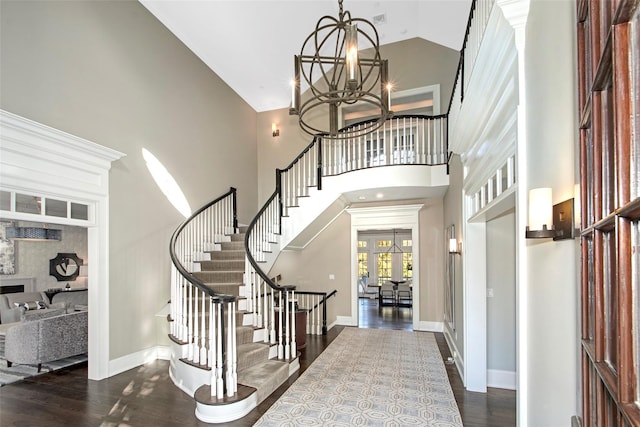 5 Sutton Farm Dr, Chappaqua, NY 10514 - entrance foyer with french doors, high vaulted ceiling, stairway, dark wood-style floors, and a chandelier