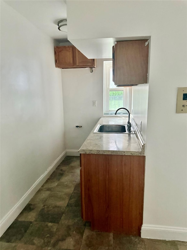 600 Pelham Road Building B Unit E, New Rochelle, NY 10805 - kitchen featuring light countertops and brown cabinets