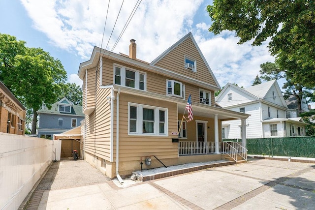 1314 College Point Blvd, College Point, NY 11356 - view of front of property with a porch and a chimney