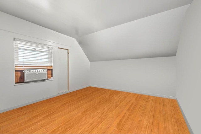 1314 College Point Blvd, College Point, NY 11356 - additional living space with lofted ceiling, cooling unit, and light wood-type flooring