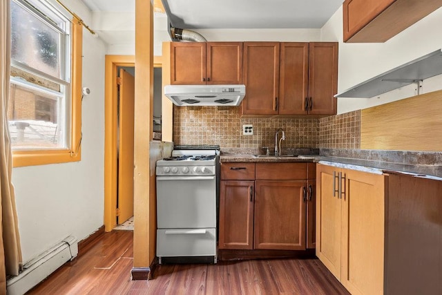 1314 College Point Blvd, College Point, NY 11356 - kitchen featuring range hood, white gas stove, baseboard heating, dark wood-style floors, and tasteful backsplash
