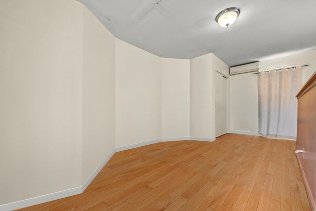 1314 College Point Blvd, College Point, NY 11356 - interior space with a wall mounted air conditioner and light wood-type flooring