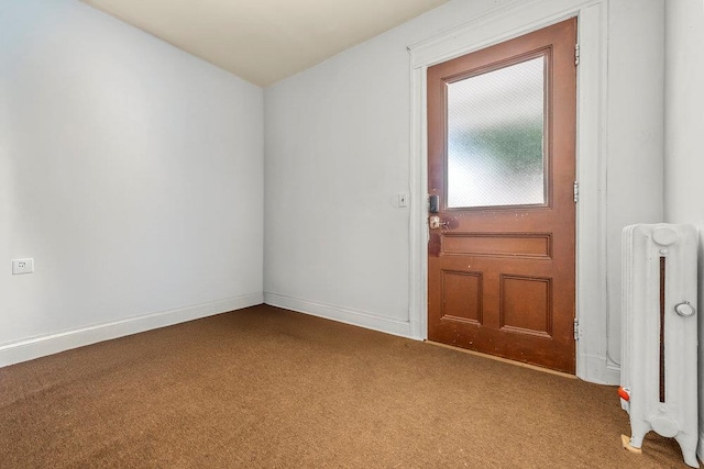 1314 College Point Blvd, College Point, NY 11356 - carpeted spare room with radiator and baseboards